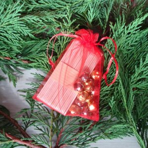 jeu soirée réveillon de noël clochette en équilibre sur bâton